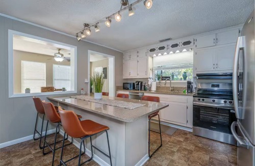 Killen House | Pet Friendly Waterfront Home + Arcade, Peloton, Boathouse, Spacious Lawn + Views