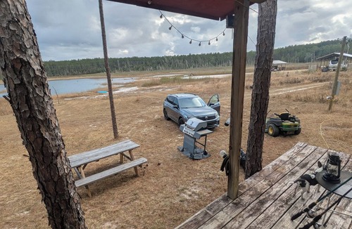 Thomas Drive Cabin | Primitive Off-Grid Fishing Cabin on 6 Acres of Florida springs lakefront