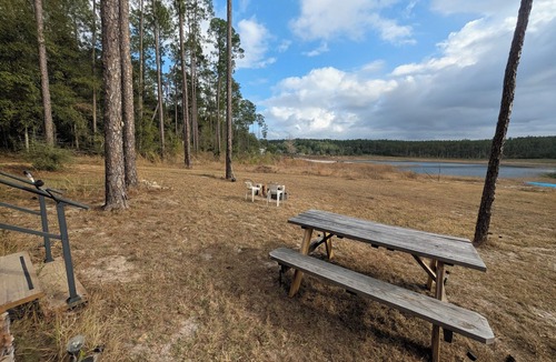 Thomas Drive Cabin | Primitive Off-Grid Fishing Cabin on 6 Acres of Florida springs lakefront