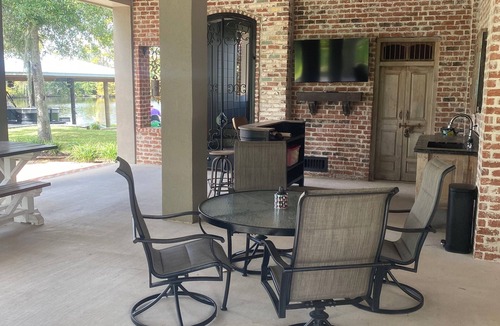 Lake Charles House | River front paradise with large dock and outdoor space, great for entertaining.