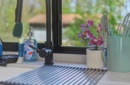Fountain House | Round Lake Getaway Camper: Full Kitchen, 2 BR's, Dock, Pedal Boat Near Ludington