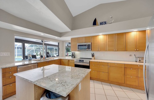 Palm Harbor House | Standalone Hot Tub, Heated Salt Pool & Game Room