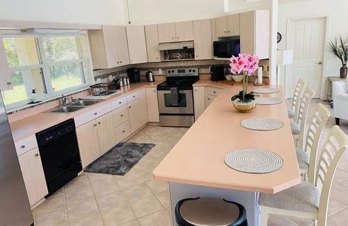 Palm Coast House | Stunning Lake house,heated pool, pet friendly, fishing spot ,restaurants ,bars