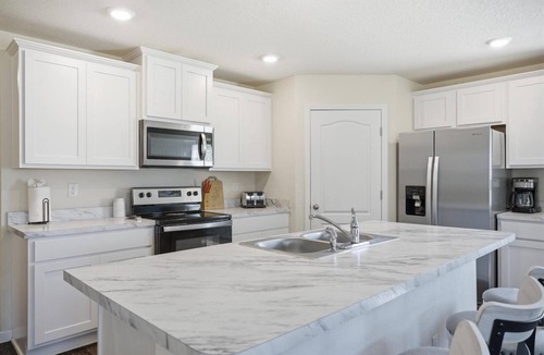 Palm Coast House | Swaying Palm Retreat | 4BR Home Near Flagler Beach | Palm Coast | Golf & Restaurants