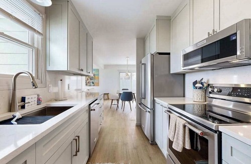 Suttons Bay House | Tranquil Lakeview Retreat in Suttons Bay, with a private sauna, & large yard