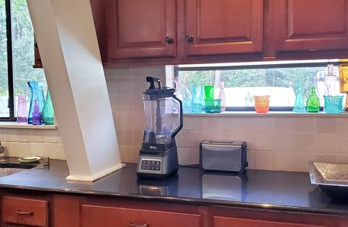 Navarre House | Updated dog-friendly home with private outdoor pool, patio, fireplace, W/D, AC