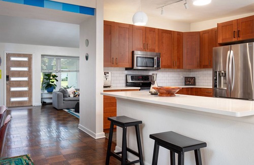 Audubon Park House | Vibrant Orlando Lakefront Cat Lover's Retreat with Pool & Gardens