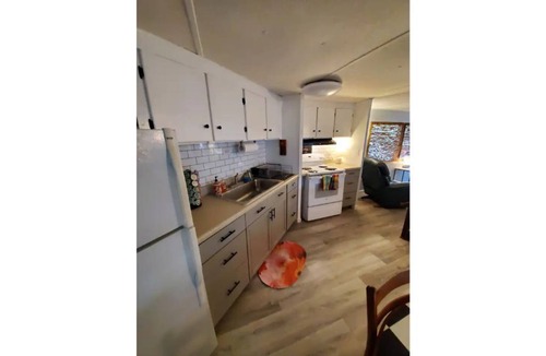 Satsuma Cottage | Waterfront Boat House updated mobile home - Work & Fish on 50 ft. Dock and slips