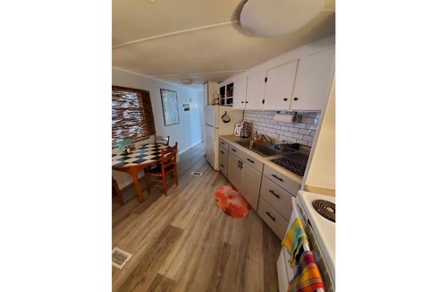 Satsuma Cottage | Waterfront Boat House updated mobile home - Work & Fish on 50 ft. Dock and slips