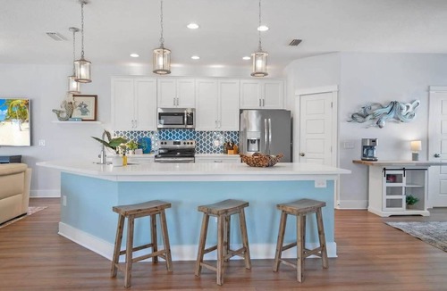 Butler Beach House | Welcome Basket, Swim Spa, Steps to Beach, BBQ!