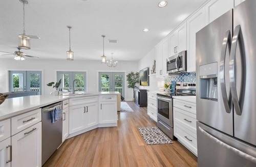 Butler Beach House | Welcome Basket, Swim Spa, Steps to Beach, BBQ!