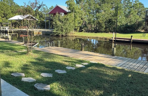 Shoreline Park House | Wine’d Down-Charming 2 BR/2BA on the water with a pool & dock in Bay St Louis