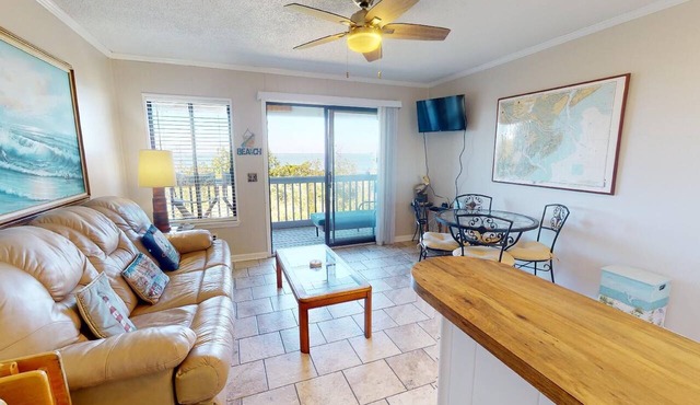 Beachfront condo w. balcony views, community pool + beach access.