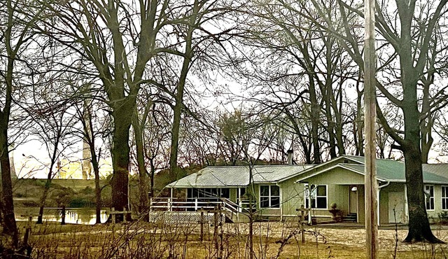 Cabin sits in the back of a wild pecan grove over looking the Arkansas River