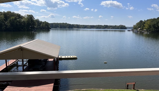 Cozy waterfront home with boat ramp, dock and gentle sloping lot.