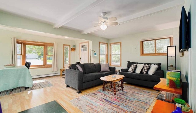 Dog-friendly cottage with fenced yard, firepit, W/D, & WiFi - walkable location