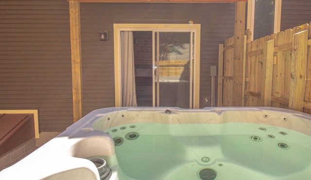 Riverfront Blufftop Escape | Hot Tub, Deck, Fireplace, Kayaks, Tubes & Firepit in Big Rapids