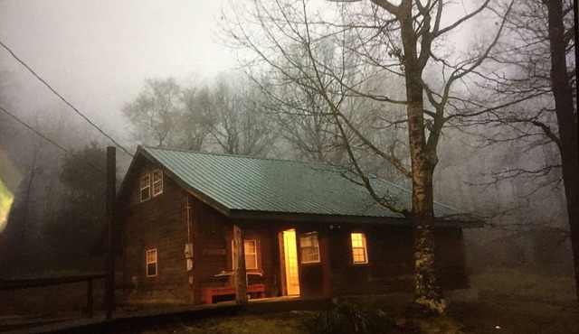 Rustic log cabin in the woods with great sunset views
