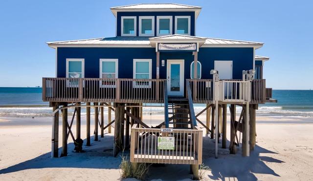 The beach is your backyard in this gulf-front cottage!