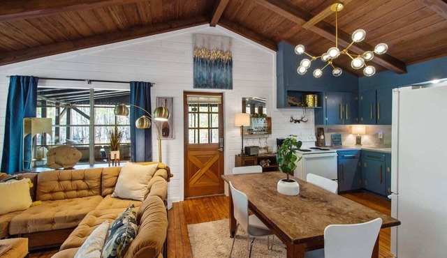 Wake up right at the water’s edge at Emerald Cove—sip coffee from hammock chairs on the screened porch, then paddle beneath a canopy of cypress trees.