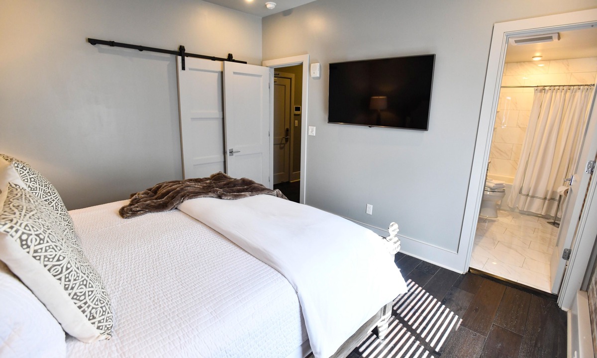 Central Business District Hotel | Luxurious Charm: Elegance with Exposed Brick Walls in New Orleans' CBD