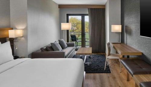 King Room with Partial River View, Sofa Bed and Balcony