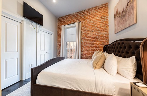 Arts/Warehouse District Condo | 📣New XL Luxury Corner Condo PRIME Historic Downtown Location HUGE Balcony Wrapped in Wrought Iron