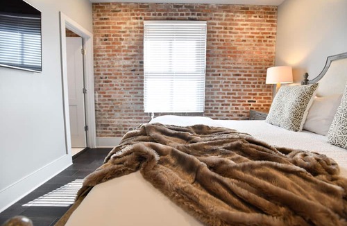 Central Business District Hotel | Luxurious Charm: Elegance with Exposed Brick Walls in New Orleans' CBD
